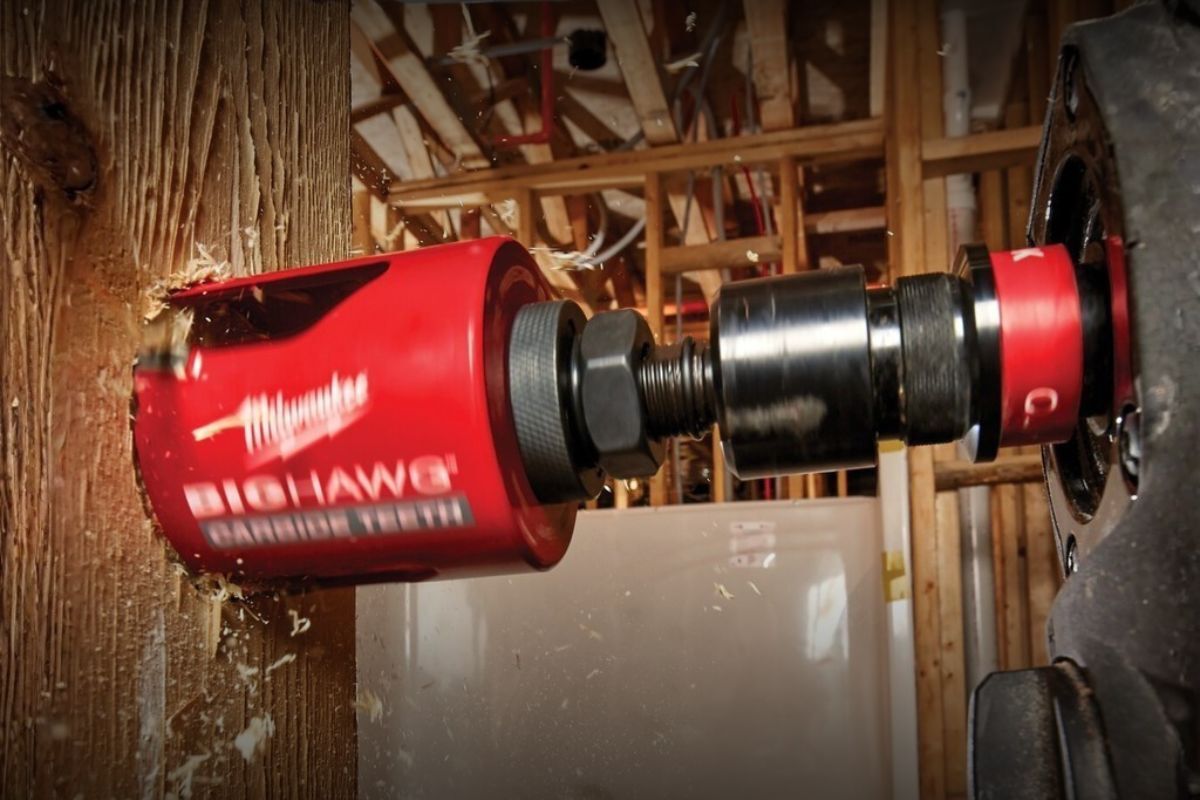 BIG HAWG™ Carbide Hole Saws (Multiple Sizes) The BIG HAWG™ Carbide Hole Saw attached to a drill and drilling a hole into a wooden beam