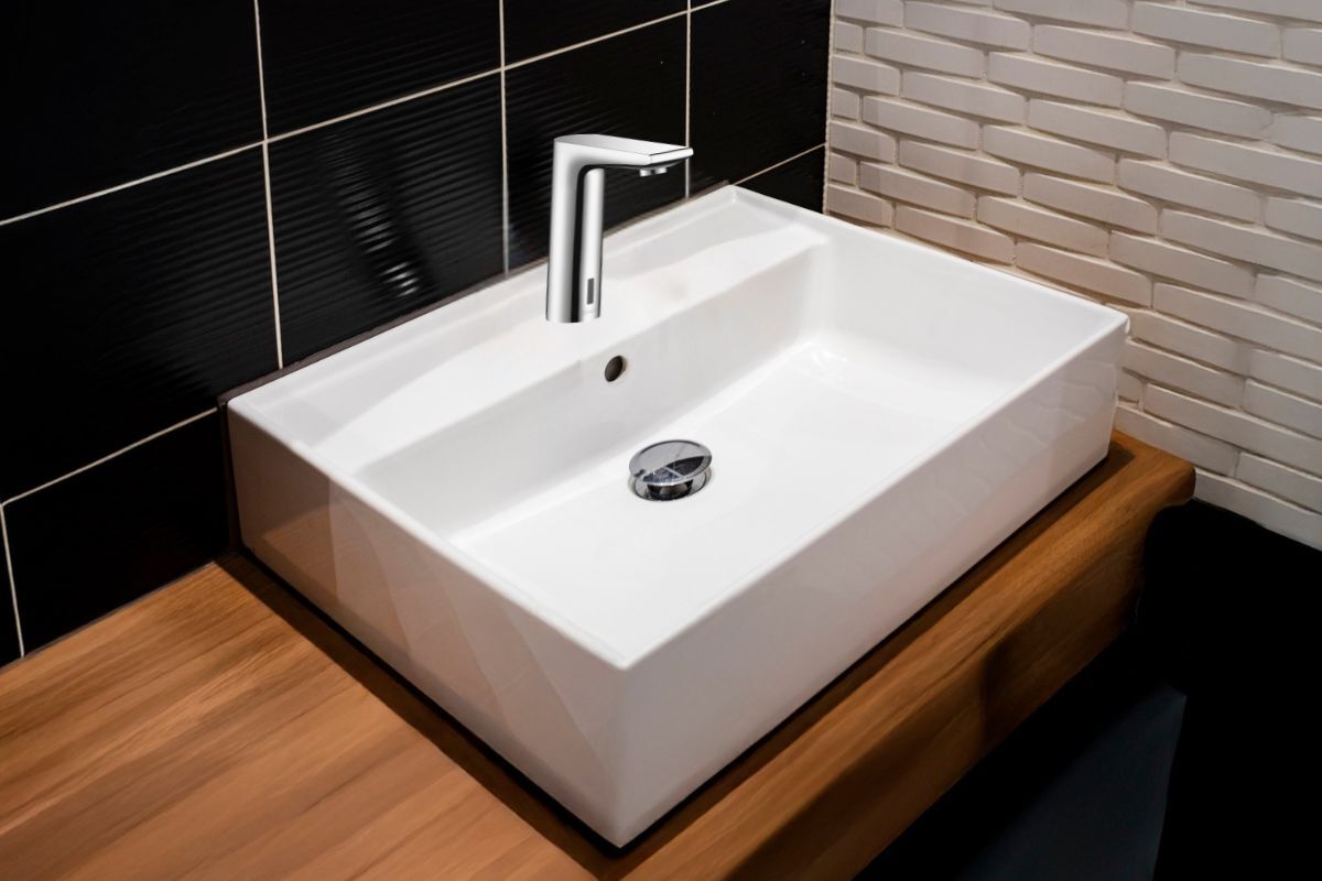 The chrome Hansgrohe Metris S Electronic Faucet&nbsp;installed on a white bathroom sink